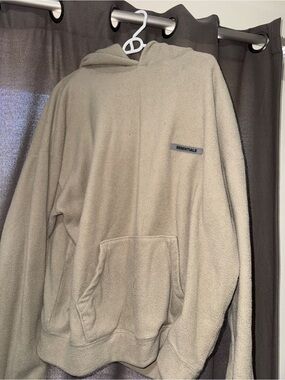 Essentials Fleece Pullover Hoodie in Beige with Gray Logo Patch